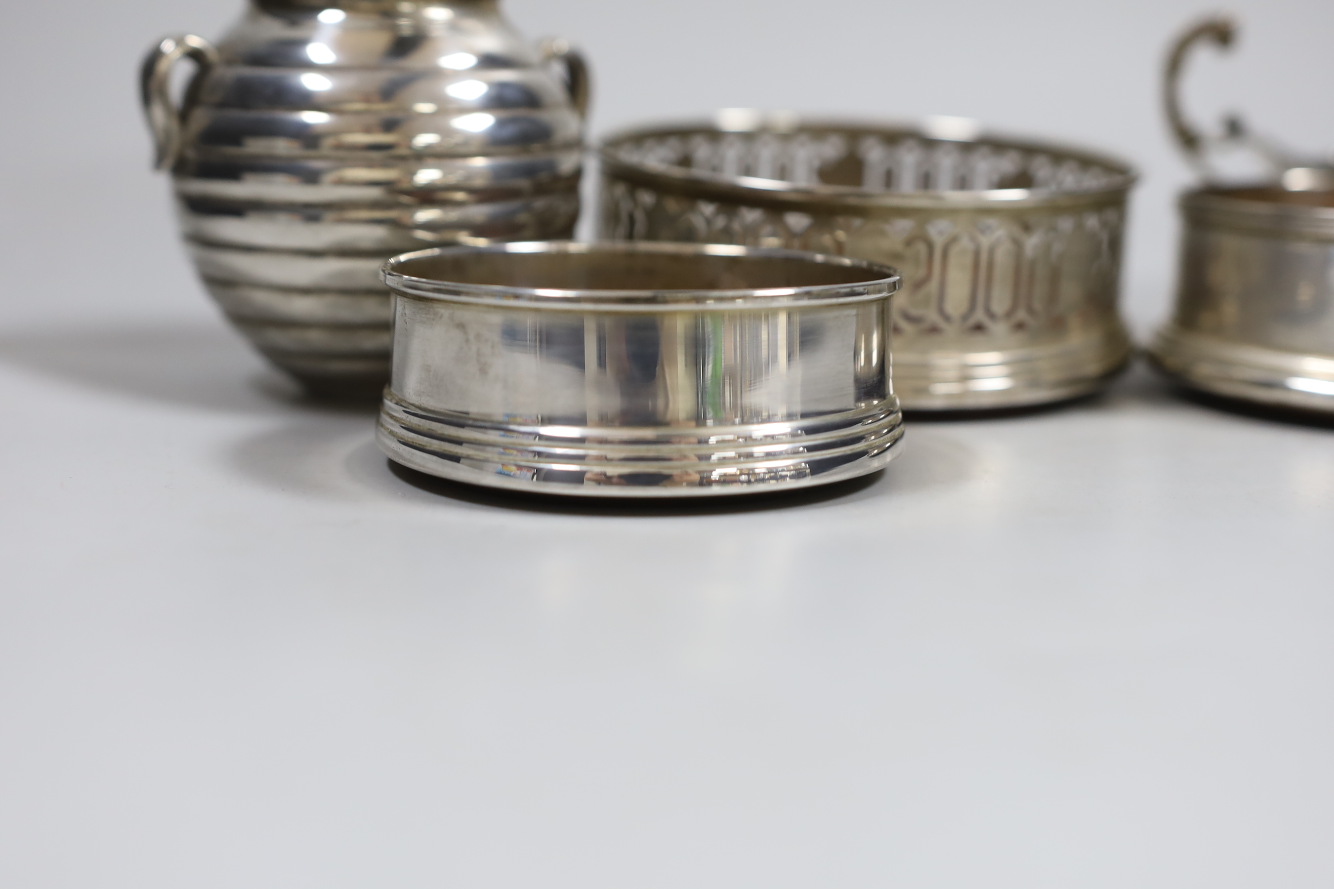 Three modern silver coasters, largest 12.2cm., a modern 925 dish and cup.